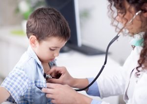 Boy getting a doctors checkup image