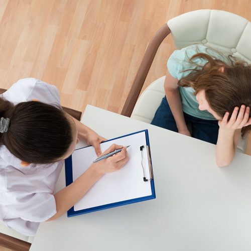 Clinical psychologist talking to patient