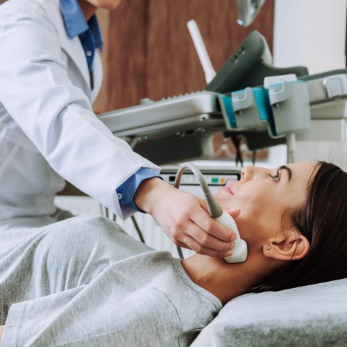 Woman undergoing ultrasound scan in Endocrinology clinic
